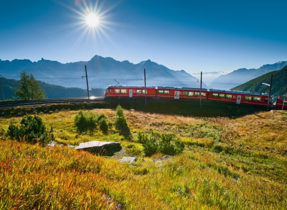 The Bernina Express A train travels up a mountain through the Alps