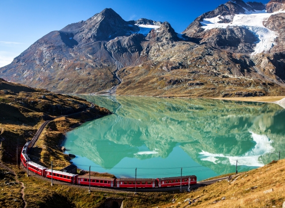 train in the scenic swiss alps around bernina and moteratsch glacier