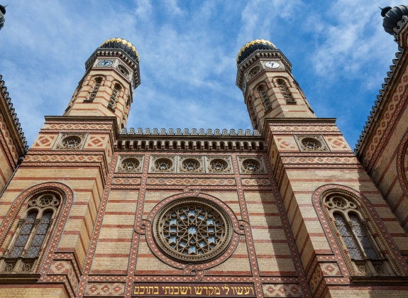 Budapest synagogue (Dohany Synagogue) main entrance taken from outside. The two iconic towers of the synagogue can be seen in the foreground. The Great Synagogue is the second biggest in the World