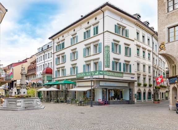 The Romantik Hotel Wilden Mann, spanning seven historic Lucerne townhouses, offers 51 rooms and suites, two restaurants serving regional Swiss cuisine, and a central location in Lucerne's old town