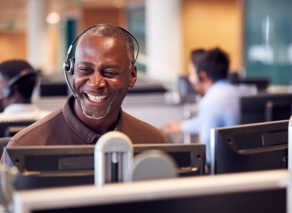Rail expert Wearing Telephone Headset Talking To Caller