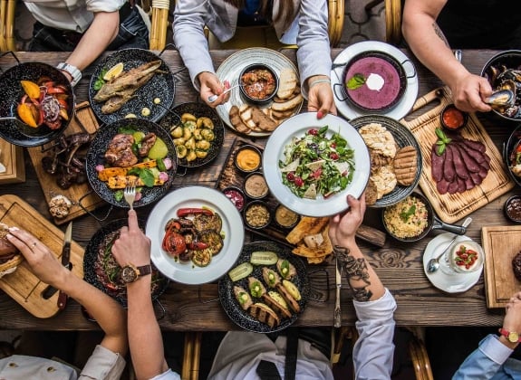 group of hands at a table_culinary