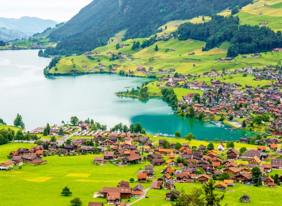 Beautiful rural landscape view on the green mountains and village in Switzerland