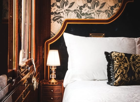 inside view of the Venice, grand suite bedroom onboard the VSOE