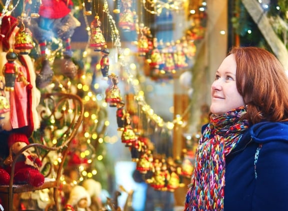 woman window-shopping-at a Christmas-market