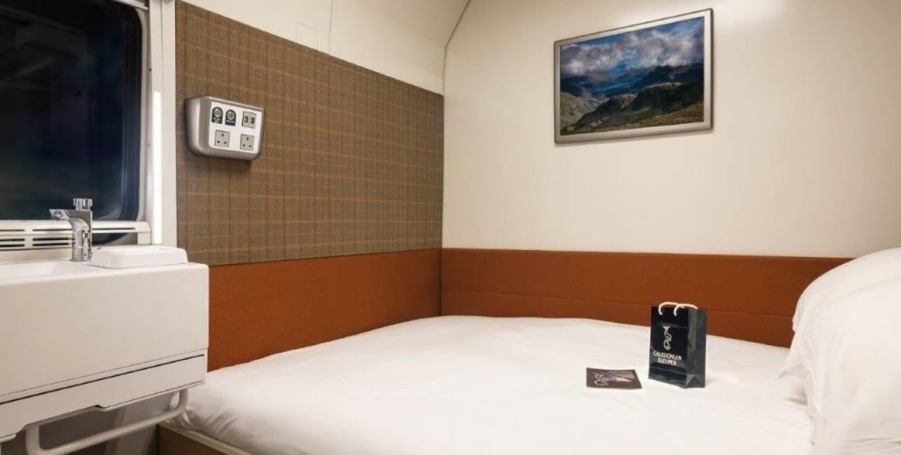The Caledonian Double A double bed inside a train cabin