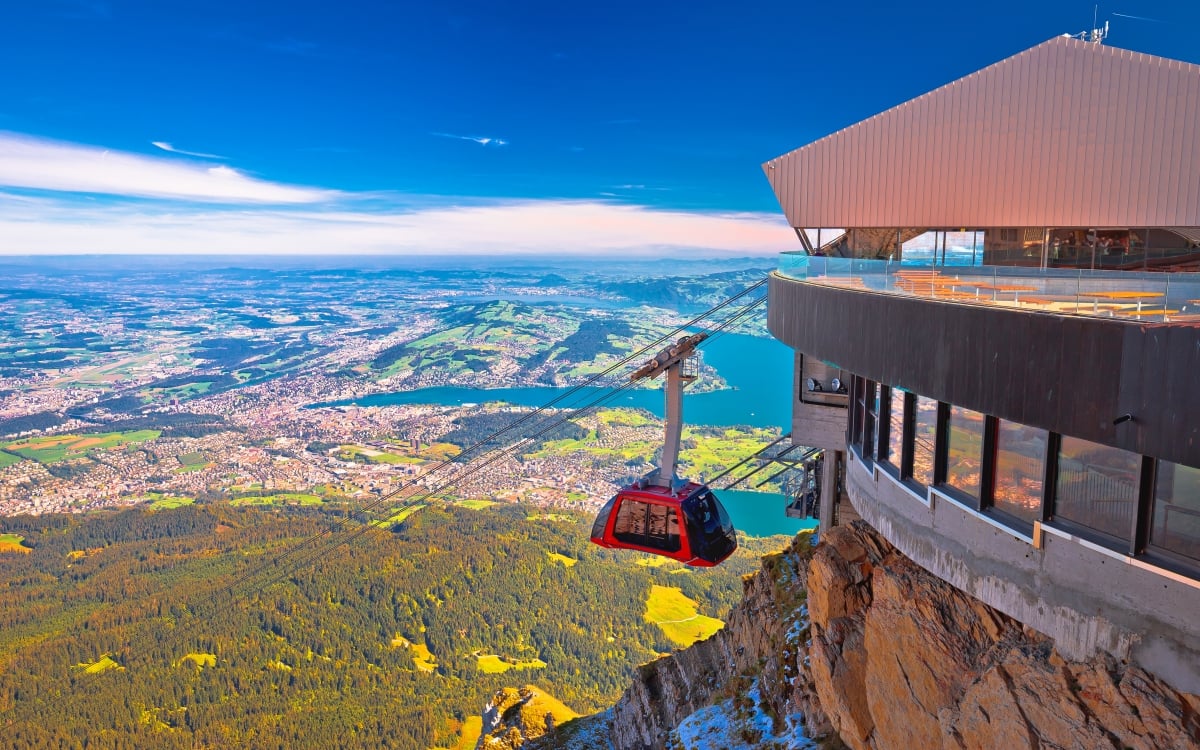 Mount Pilatus Gondola A Gondola approaches the terminal with mountain views in background