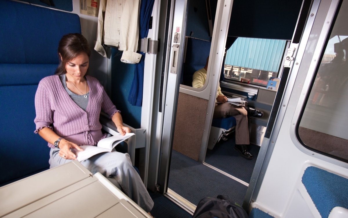 woman relaxing in an amtrak roomette
