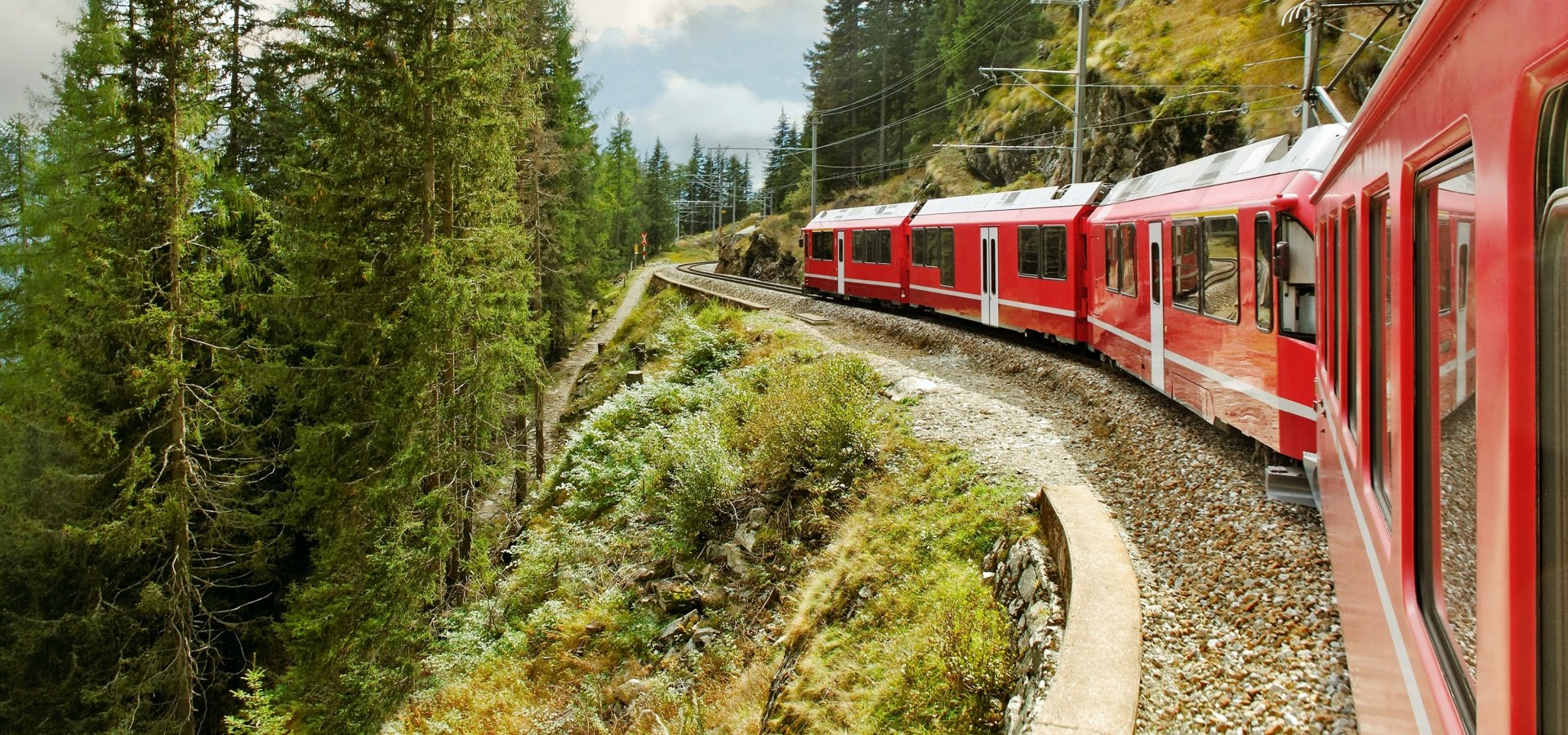 Bernina Express train traveling through mountains