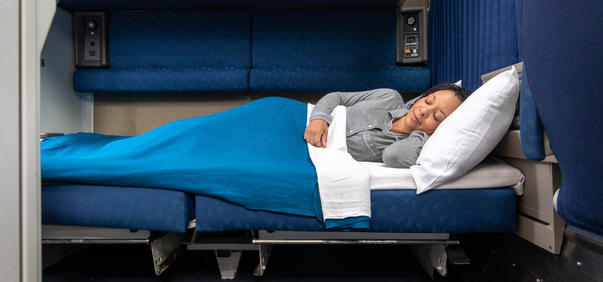 woman sleeping in Amtrak's first class private room