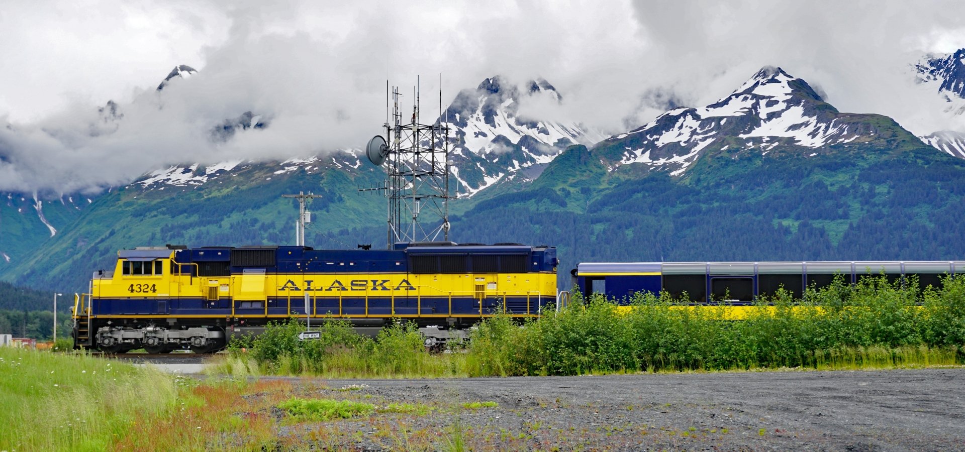 Alaska Railroad train exterior by mountains