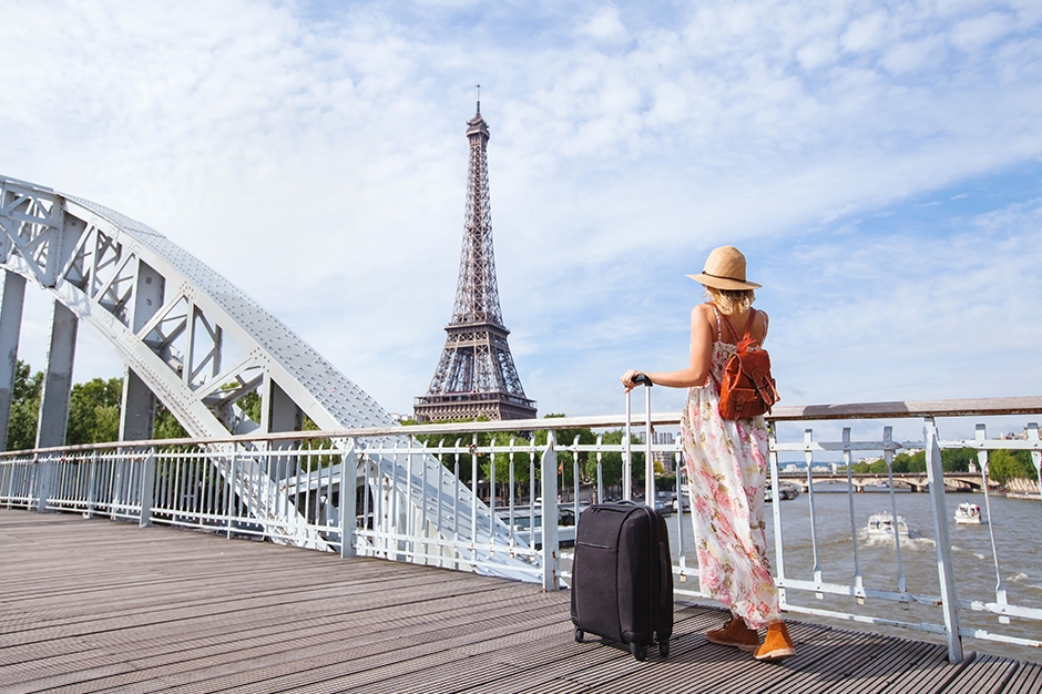 Woman with her luggage in France