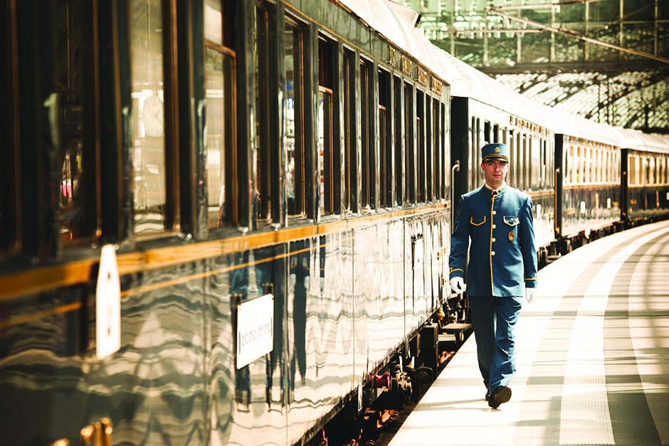 Attendant walking next to the Venice Simplon-Orient-Express