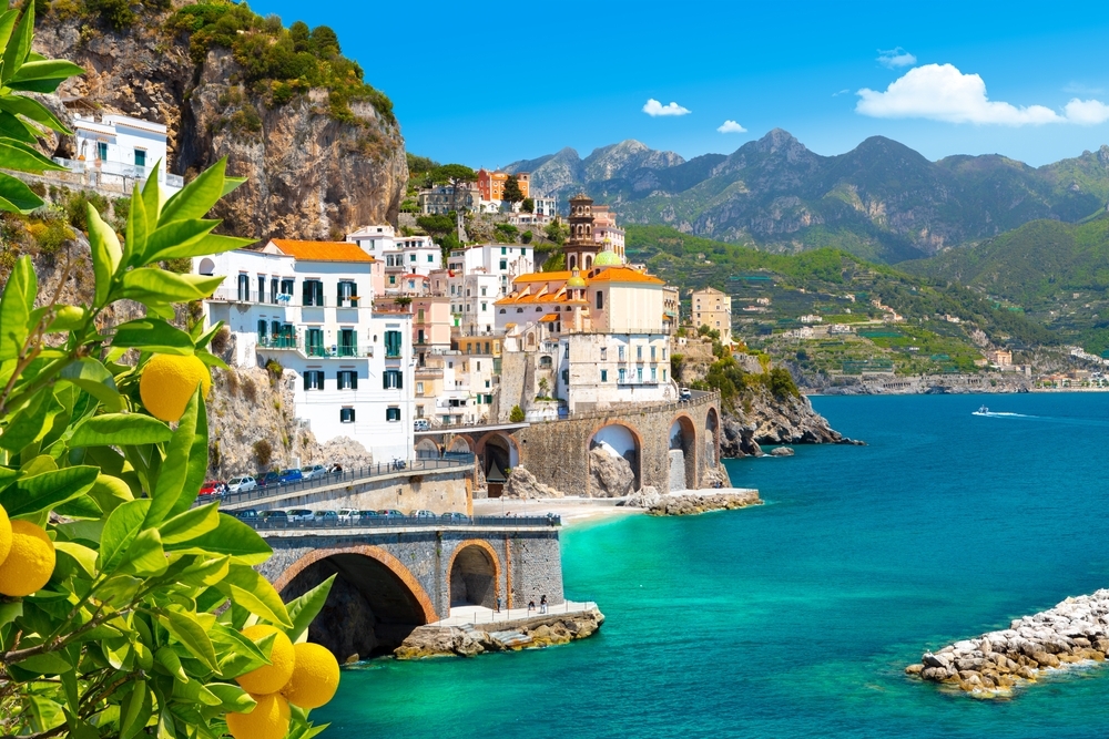 Beautiful view of Amalfi on the Mediterranean coast with lemons in the foreground, Italy