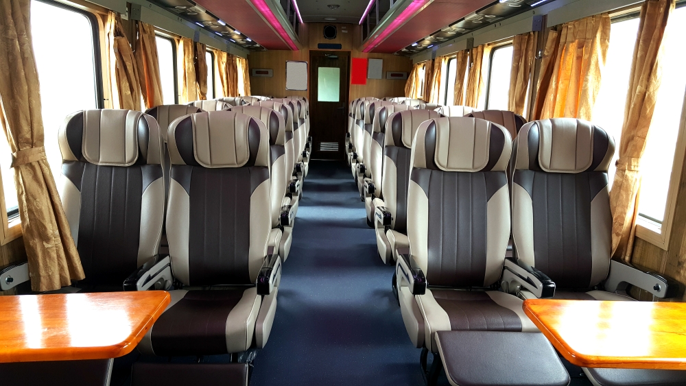 Onboard an empty train carriage - 2 seats are either side of the aisle