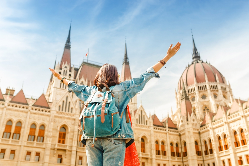 woman enjoying great view of the Parliament building in Budapest city